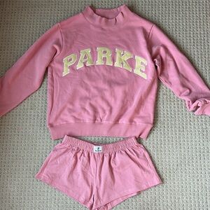 Parke mock neck (S/M) and shorts (S). Conch + Peel
